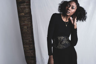 A Bad Button bespoke corset design by Alisha Martin featuring a gold bamboo motif on a black fabric