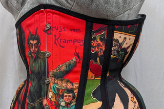 A The Bad Button custom corset design featuring krampus print fabric and black detailling