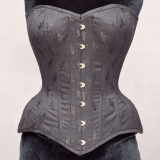 A Bad Button bespoke corset design by Alisha Martin featuring black fabric with small floral detailing