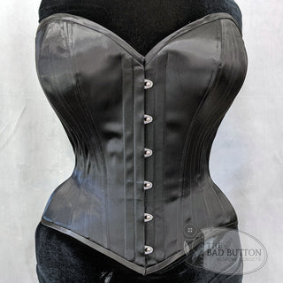 A Bad Button bespoke corset design by Alisha Martin featuring black fabric