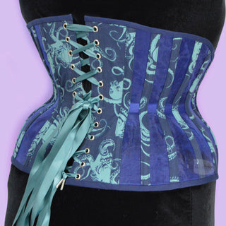 A Bad Button bespoke corset design by Alisha Martin featuring a deep blue fabric covered in octopuses