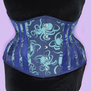 A Bad Button bespoke corset design by Alisha Martin featuring a deep blue fabric covered in octopuses