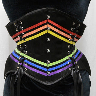A Bad Button bespoke corset design by Alisha Martin featuring rainbow ribbon detailing on a black background for a pride corset