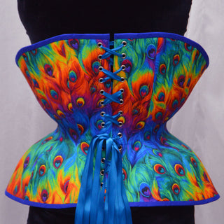 A Bad Button bespoke corset design by Alisha Martin featuring a bold rainbow peacock fabric with blue detailing
