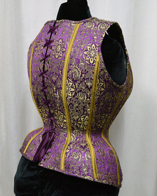 A Bad Button bespoke corset design by Alisha Martin featuring lush brocade fabric in purple gold and yellow