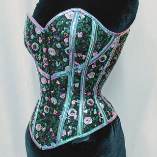 A Bad Button bespoke corset design by Alisha Martin featuring a sequin floral-inspired fabric and holographic detailing