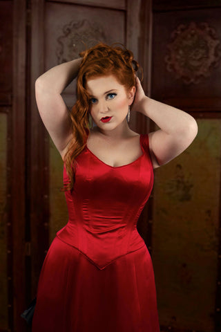 A Bad Button bespoke corset design by Alisha Martin featuring a red corseted down. It's the seductive temptress ensemble Satine wears in Moulin Rouge