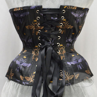 A Bad Button custom corset design by Alisha Martin featuring black fabric with gold and purple bees wearing crowns