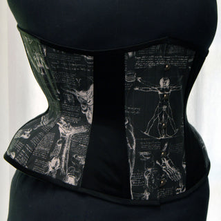 A Bad Button custom corset design by Alisha Martin featuring a black Da Vinci print