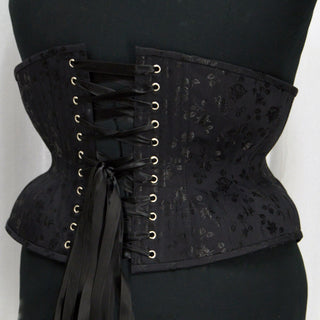 A Bad Button custom corset design by Alisha Martin featuring a black fabric with small satin flower detailing