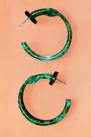 ouroborus snake hoop earrings by the bad button in green and gold