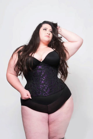 Purple rosebud coutil corset by The Bad Button is a purple fabric with delicate purple floral detailing
