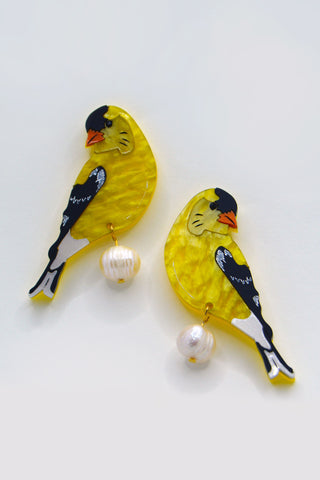 The Bad Button earrings featuring a yellow gold finch with pearl detailing